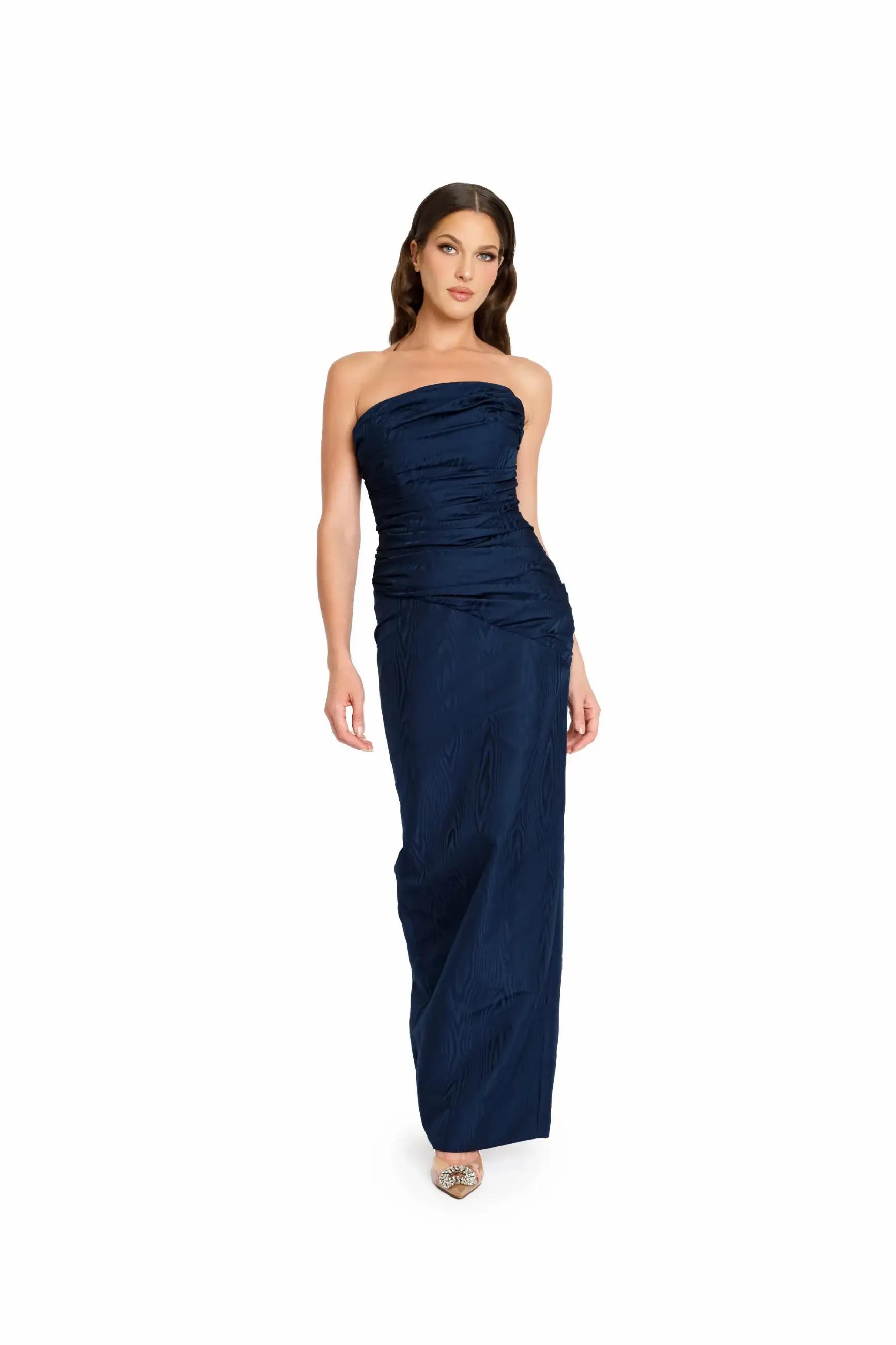 Model wearing a long navy evening gown