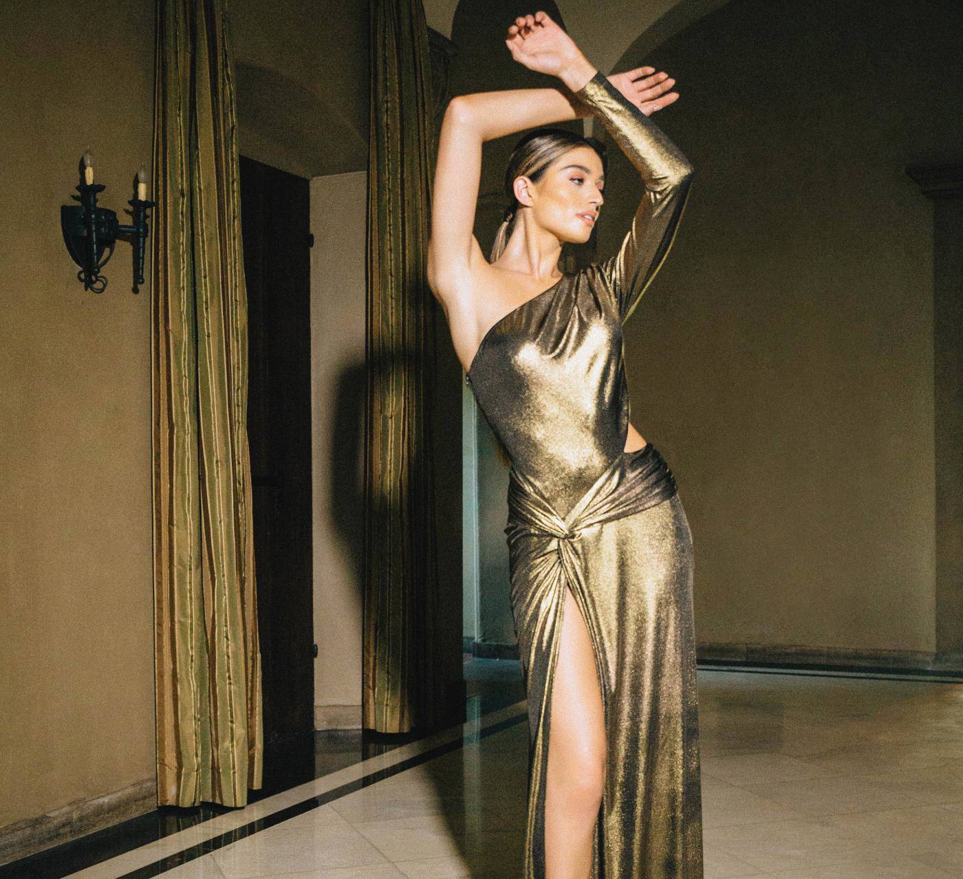Model wearing a gold gown