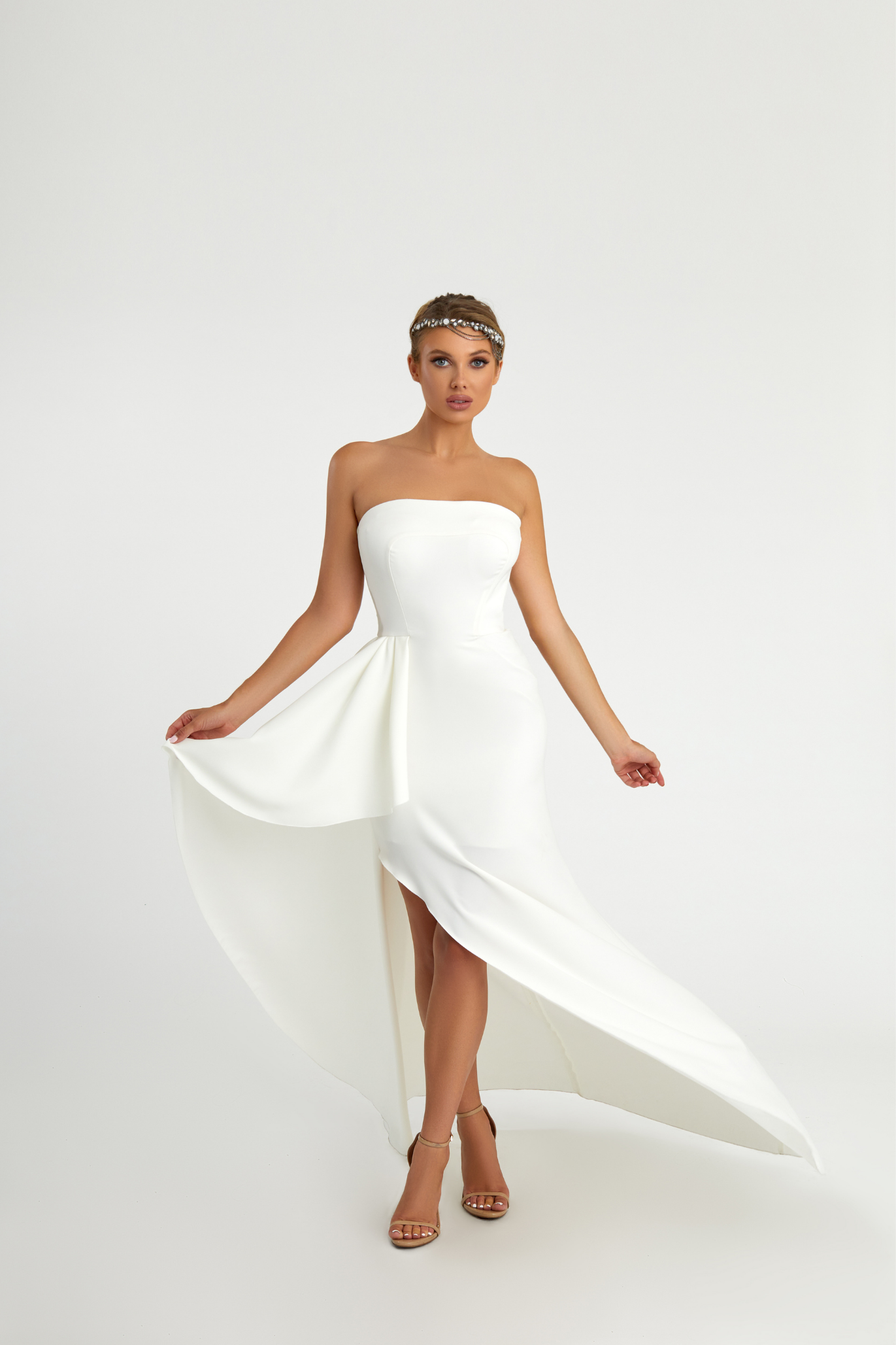 Model wearing a white gown