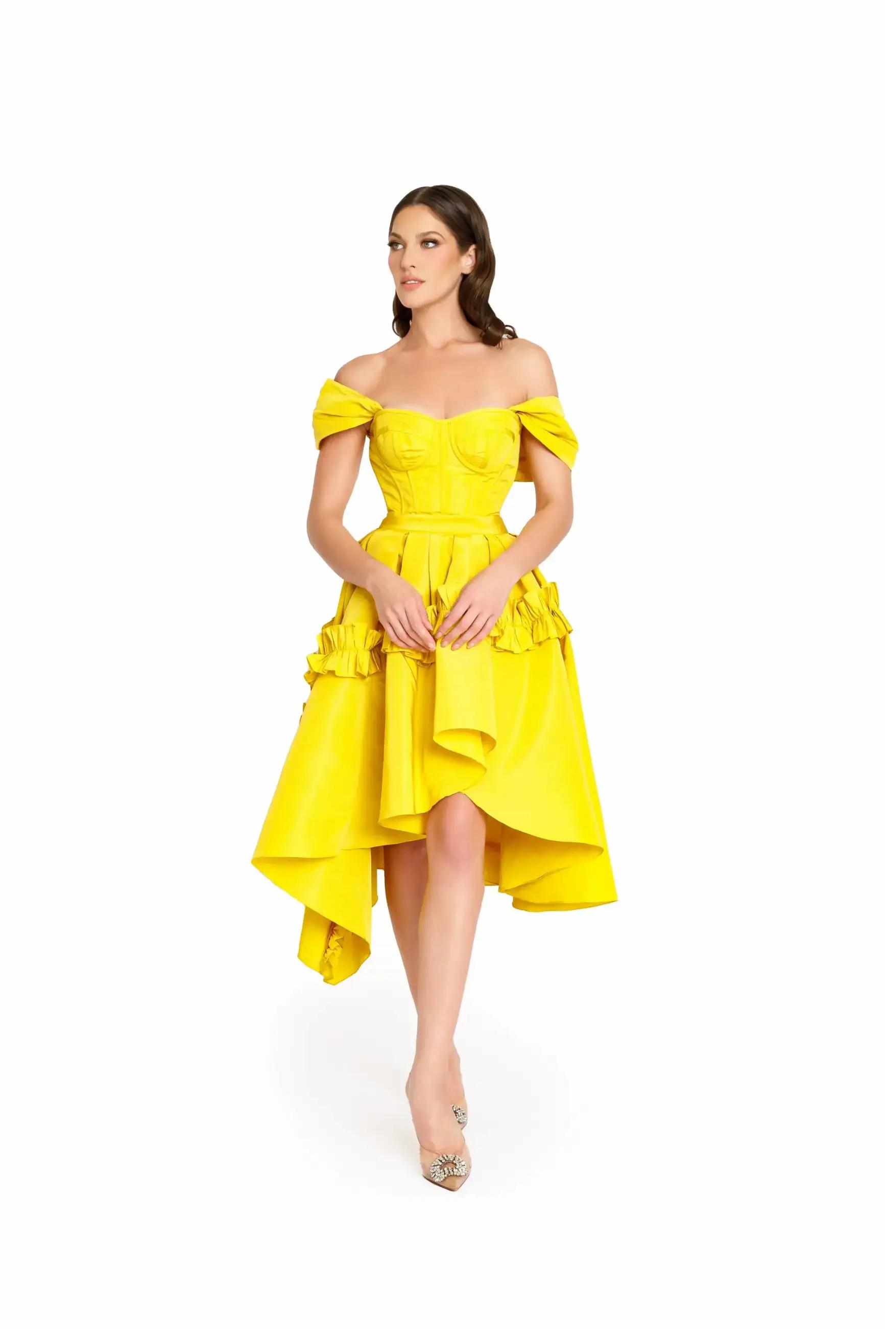 Model wearing a yellow evening dress