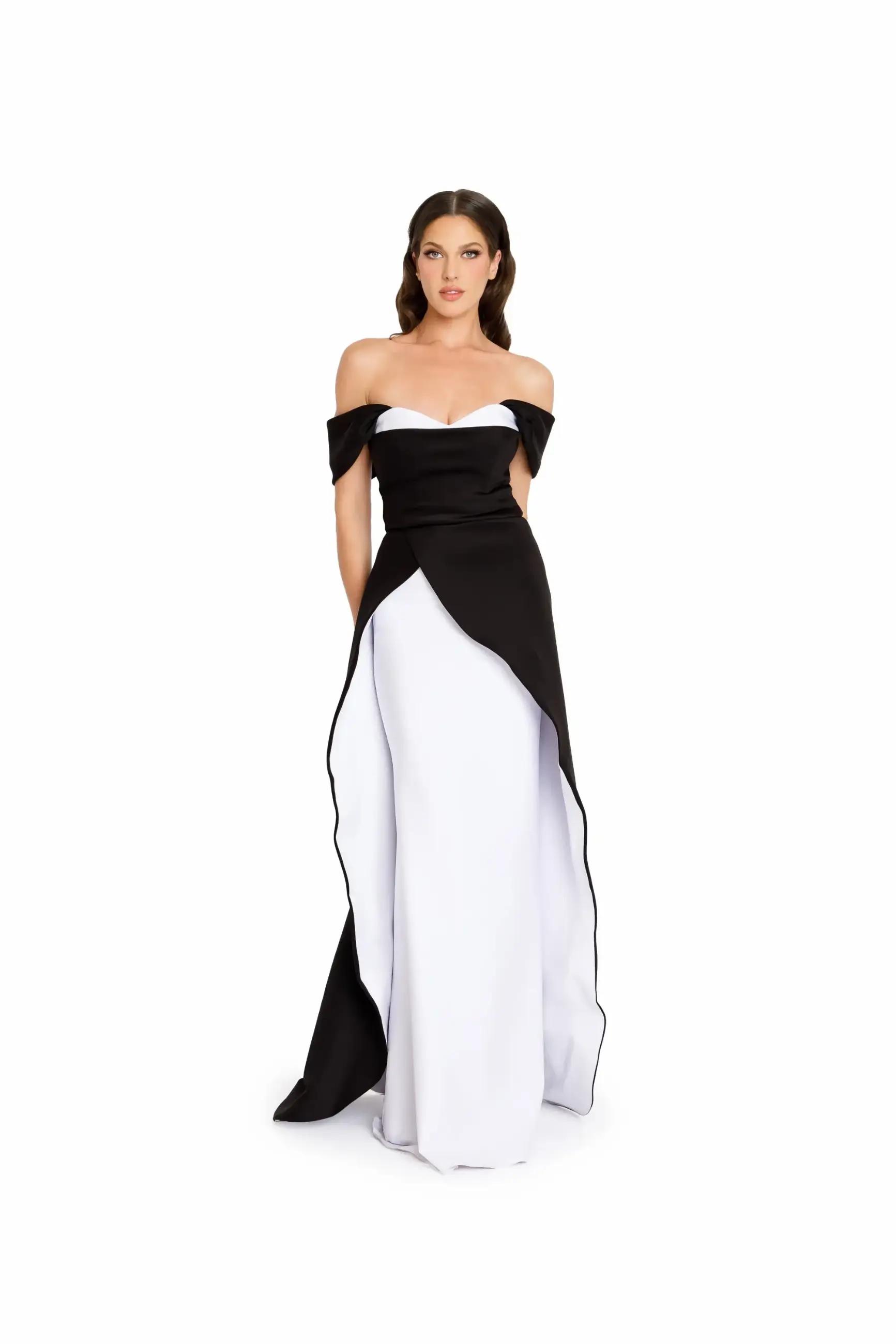 Model wearing a long black & white evening gown