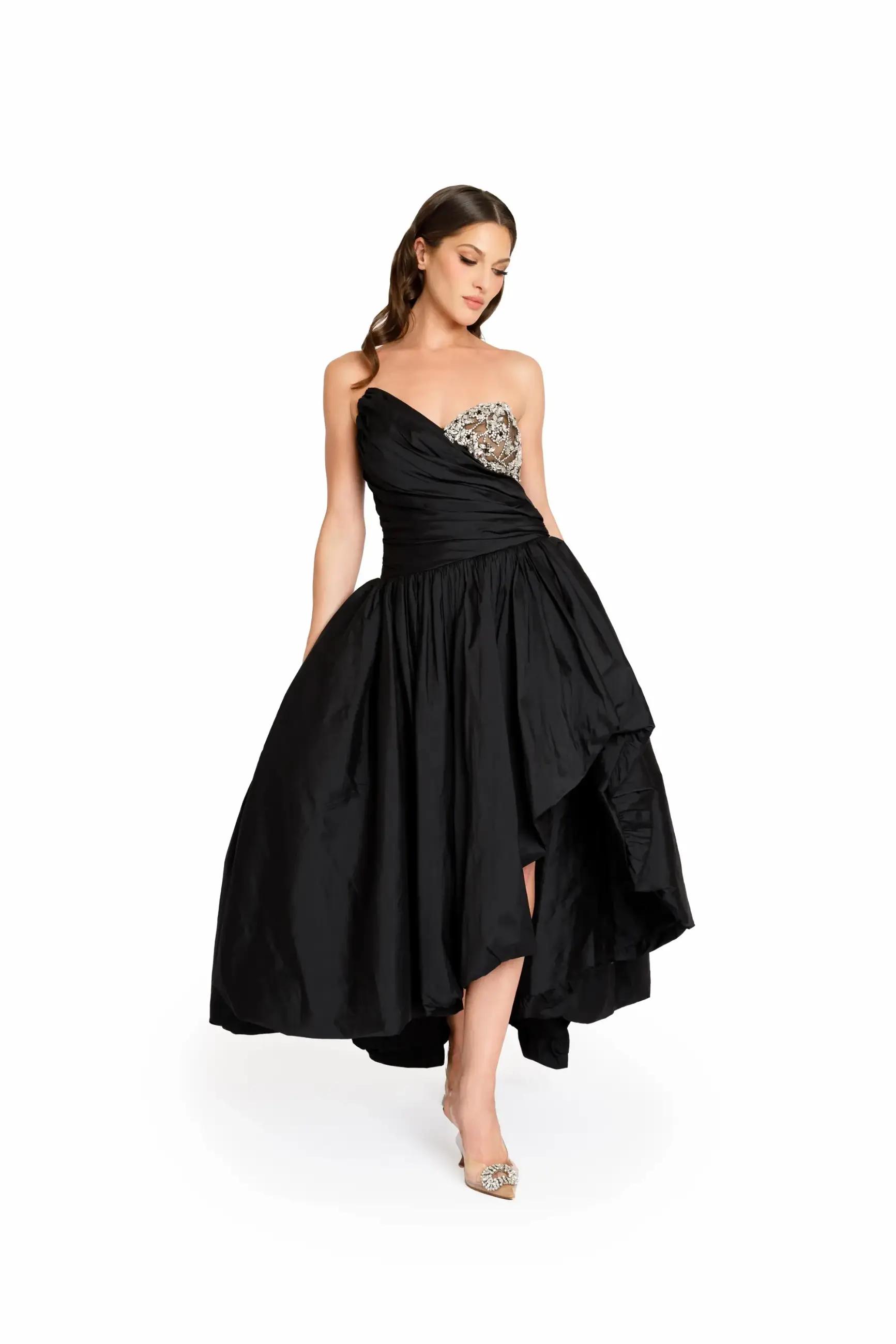 Model wearing a long black dress