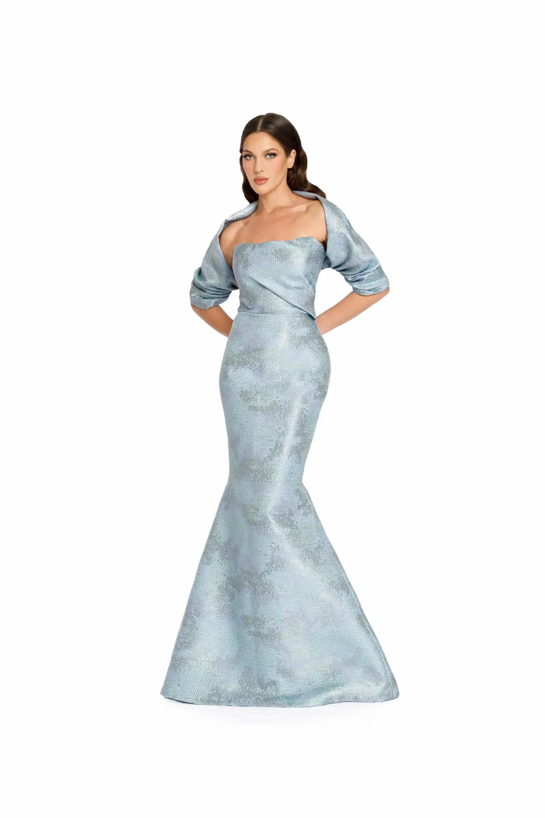 Model wearing a long light blue evening gown