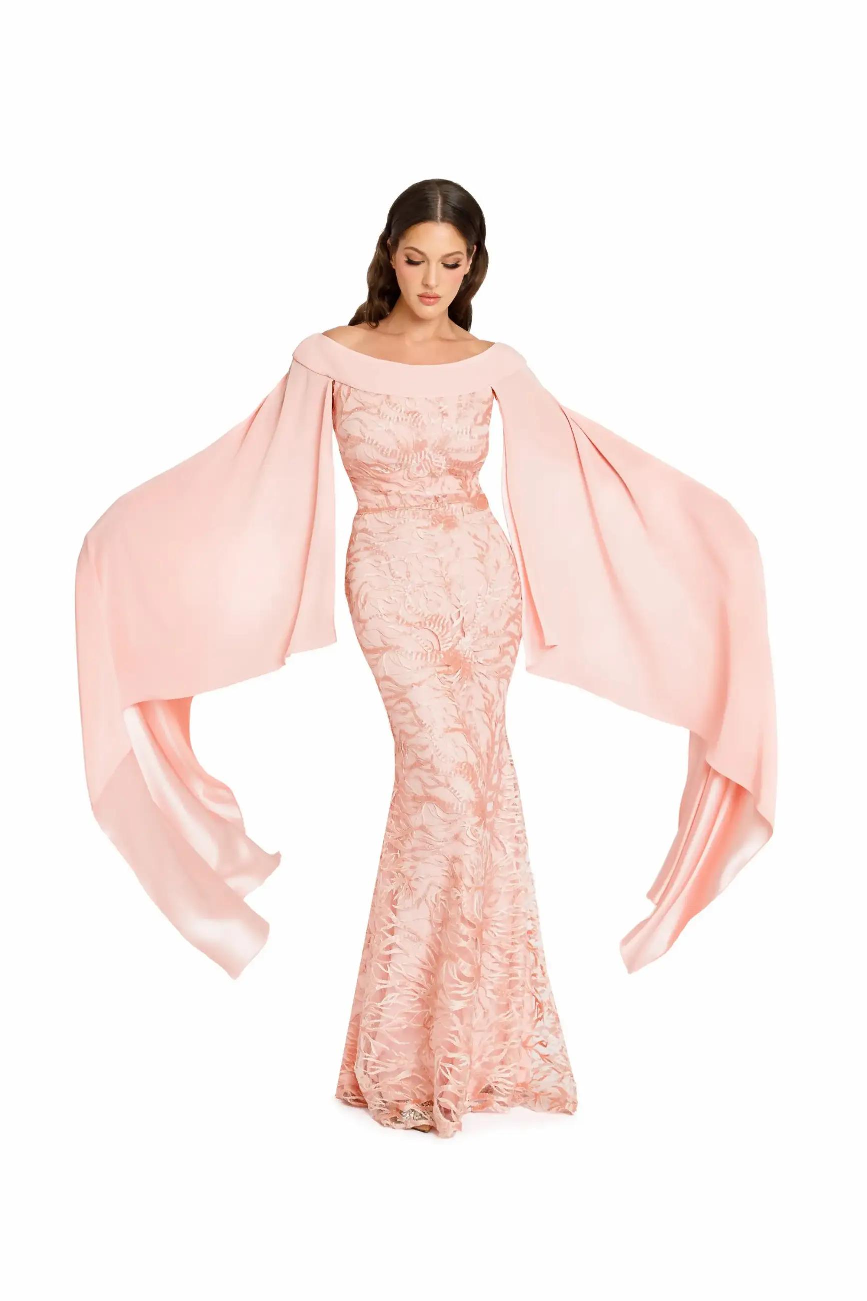 Model wearing a long pink evening gown