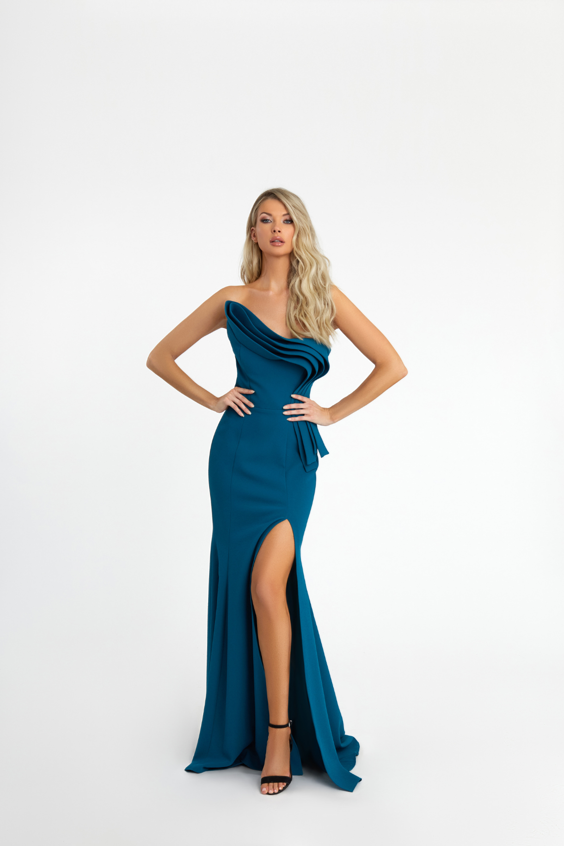 Model wearing a long sea blue gown